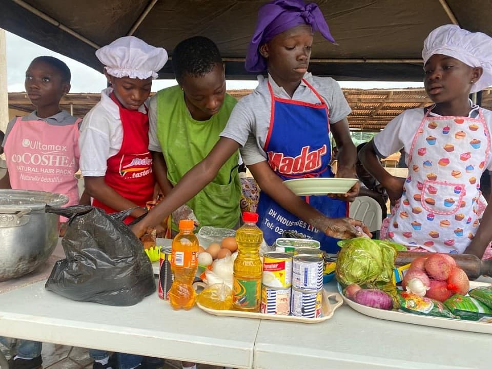 Learners showing the dishes they cooked